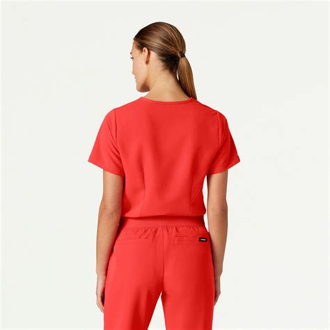 Rhena Essential 1 Pocket Scrub Top In Solar Red Women S Tops By Jaanuu