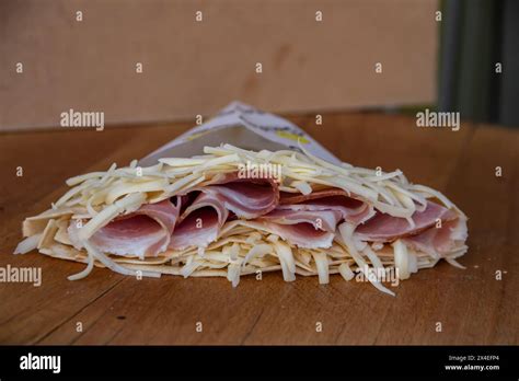 A Savory Pancake Filled With Ham And Melted Cheese Offers A Delightful
