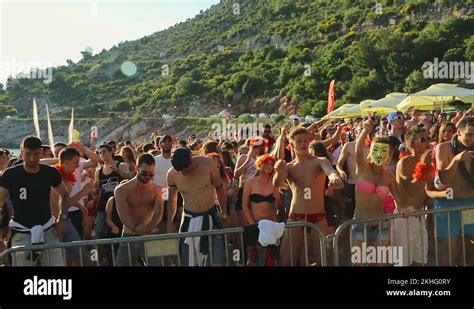 Crowd of young people dancing at the beach party. People dancing on the beach Stock Video ...