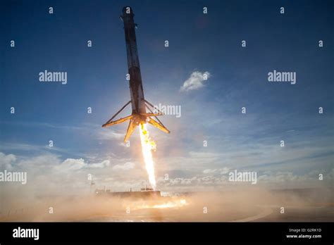 The SpaceX Falcon 9 reusable launch vehicle fires booster rockets as it ...