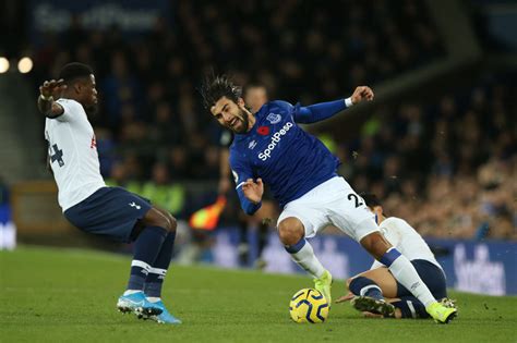 Son Heung-min consoled by Everton players led by Seamus Coleman after Andre Gomes' injury