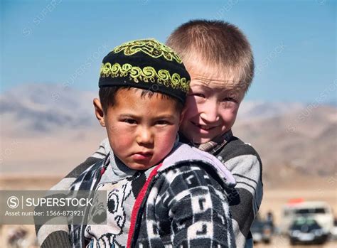 portrait of two Kazakh boys in the Altai Region of Bayan-Ölgii in ...