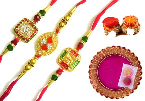 Shiv Gold Plated Stoned Swastik And Red Kundan Rakhi 3 PC Combo With