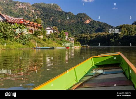 Boat Travelling On Nam Ou River In Nong Khiaw Village Laos Stock Photo