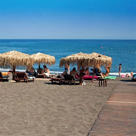 Perivolos Beach The Longest Black Sand Beach In Santorini