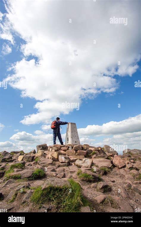 Man At The Trig Point Hill Walking In The Peak District National Park