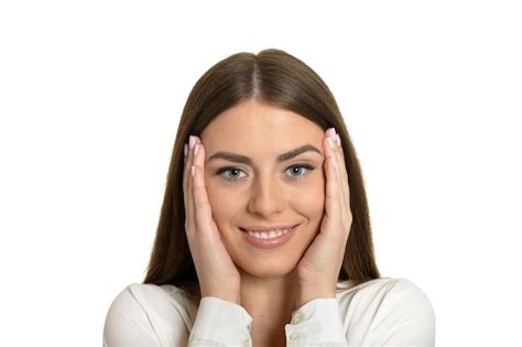 Premium Photo Portrait Of Brunette Woman Holding Head In Hands Isolated