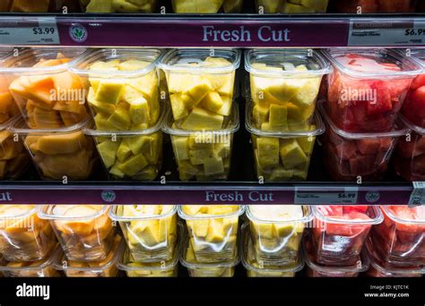 Fresh cut fruit in plastic take away containers a a Whole Foods in Stock Photo: 166493423 - Alamy