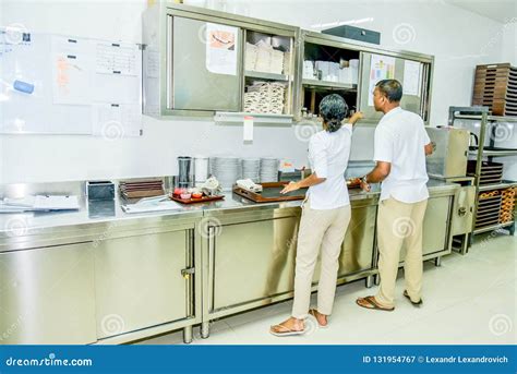 Kitchen Staff Team In Uniform Busy With Their Work Editorial