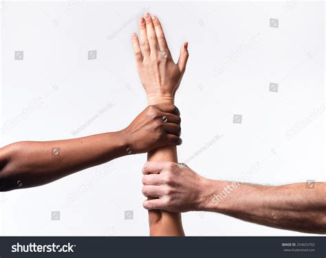 Black African American And Caucasian Hands Holding Together White Skin