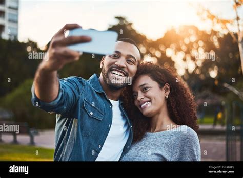 Now Well Never Forget This Day A Young Couple Taking Selfies Together