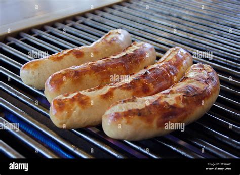 Vier Bratw Rste Auf Dem Grill Stock Photo Alamy