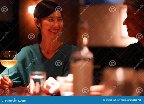 Woman drinking at the bar stock photo. Image of moody - 243964514