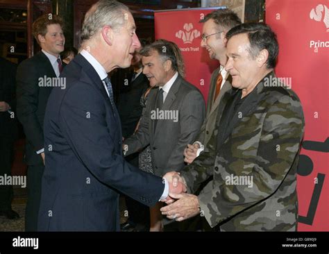 Prince charles shakes hands with actor robin williams hi-res stock ...