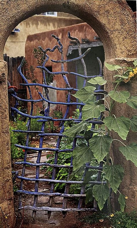 An Old Gate With Vines Growing Out Of It