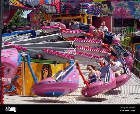 people having fun on a fairground ride Bakewell Derbyshire England ...