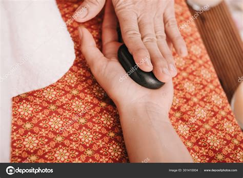 Cropped View Masseur Doing Hot Stone Massage Woman Spa Salon Stock Photo HayDmitriy 301410004