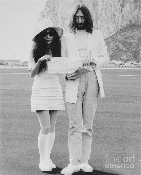 John Lennon And Yoko Ono Holding by Bettmann