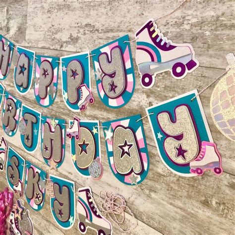 A Birthday Banner With Roller Skates And Stars Hanging From The Side Of