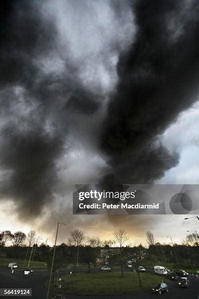 Smoke Fills The Sky As Fire Continues To Burn At The Buncefield Oil