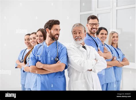 Doctor And His Colleagues In Hospital Medical Service Stock Photo Alamy