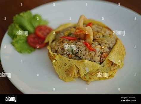 The Nasi Pattaya Is A Southeast Asian Fried Rice Dish Made By Covering