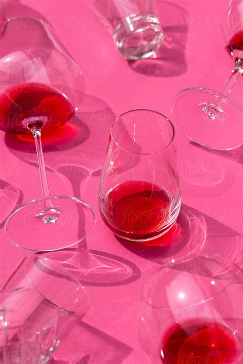 Glasses Of Red Wine On Table By Stocksy Contributor Viktor Solomin Stocksy