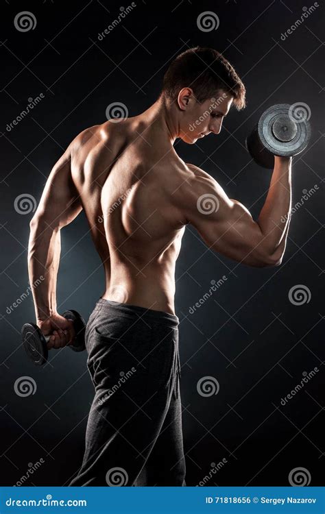 Man With Naked Torso And Dumbbells On Black Background Stock Photo
