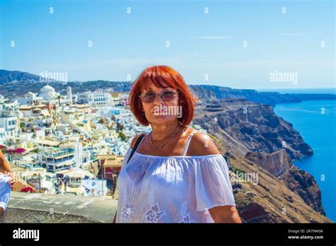Beautiful Mature Years Old Tanned Red Hair Tourists Woman Standing On A Terrace Above Rugged
