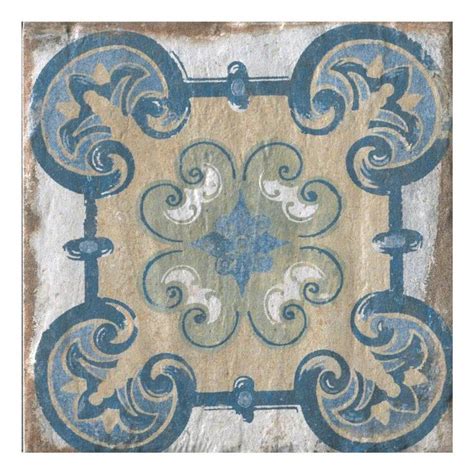 A Tile With An Ornate Design In Blue And White On The Bottom