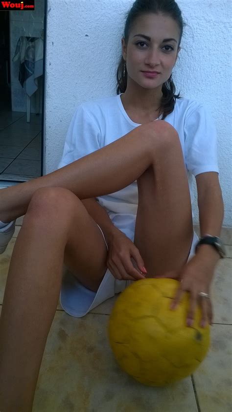 Sweet Brunette Girl Covers Her Pussy With A Football Photos