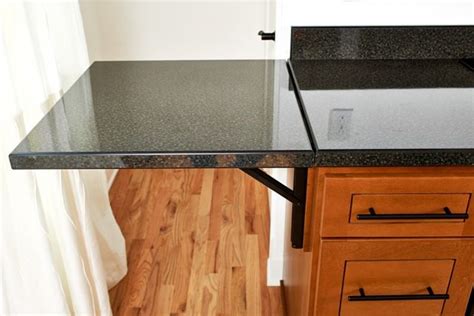 A Custom Fold Down Countertop Provides Additional Space As Needed Kitchen Remodel Countertops