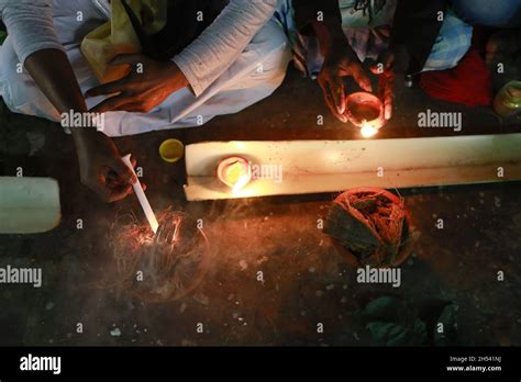 Hindu Devotees Offer Prayer As They Take Part In A Ritual Activity