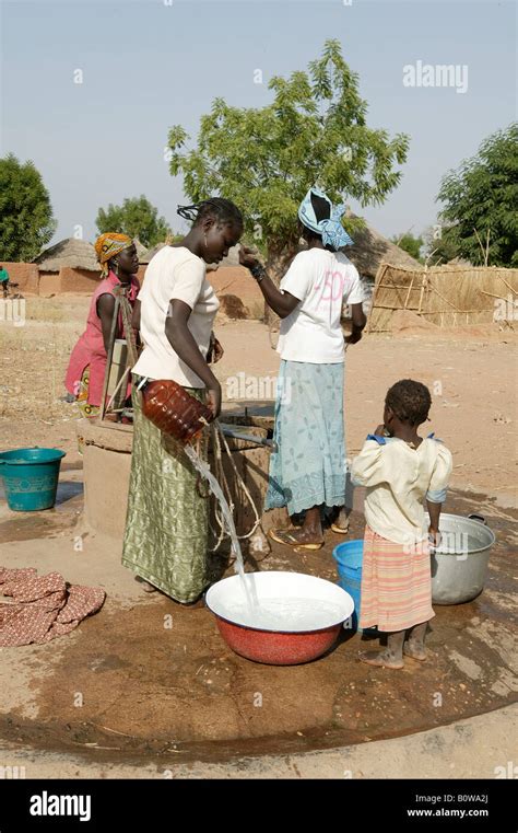 Women Fetching Water From A Well Cameroon Africa Stock Photo Alamy