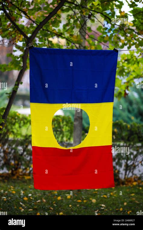 Details With The Romanian Flag With A Hole The Symbol Of The Romanian