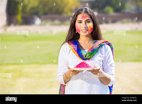 Portrait Of Happy Young Indian Woman Wearing White Kurta And Dupatta