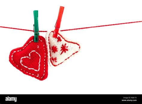 Two Knitted Hearts On A Red String Isolated On White Background Stock