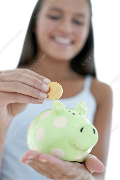 Teenage Girl Saving Money Stock Image F0029152 Science Photo Library