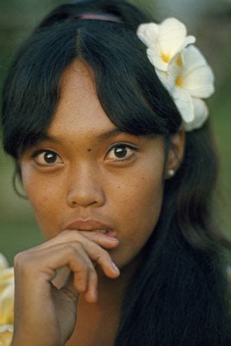 A Filipino Teenager Wears A Plumeria Blossom In Her Hair Maui Island