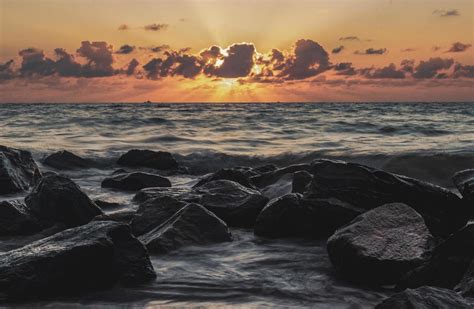 Rocky beach at sunset 1248197 Stock Photo at Vecteezy