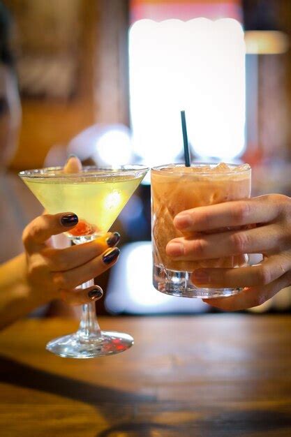 Premium Photo Closeup Of Two Glasses Of Martini Cocktail In Female