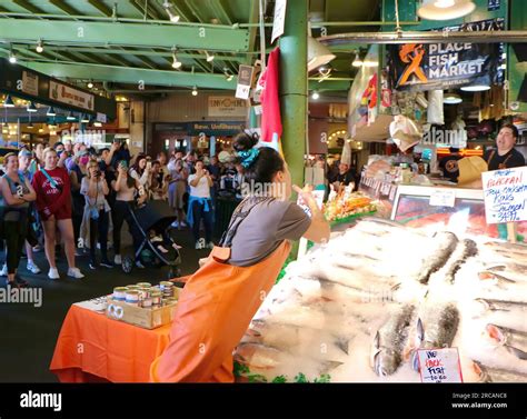 Famous for fish throwing the purchases of customers before wrapping Pike Place Fish Market ...