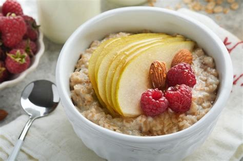 Premium Photo Oatmeal Bowl Of Oatmeal Porridge With Raspberry Pear