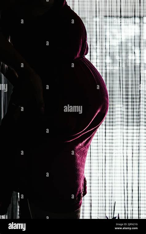 Pregnant Woman In Dark Cinematic Style Stock Photo Alamy