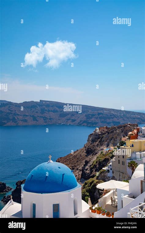 Traditional Blue Domed Greek Orthodox Church In Oia Santorini Greece