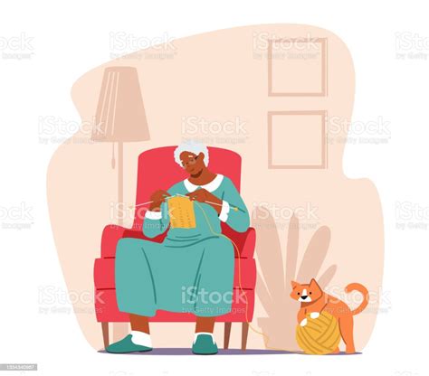 Grandmother Enjoying Knitwork Leisure Senior Woman Sitting On Armchair In Living Room Knitting