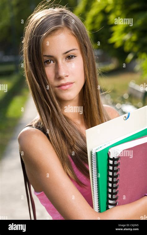 Outdoors Portrait Of A Beautiful Tanned Teen Student Girl Stock Photo