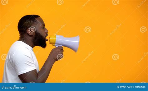 African American Man Using Megaphone For Protest Calling To Action