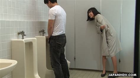 crazy asian chick uta kohaku pisses on dick of one stranger dude in a public toilet