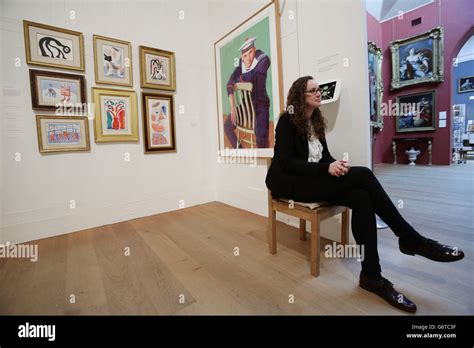 Gallery Staff Member Next To Works By David Hockney Hi Res Stock